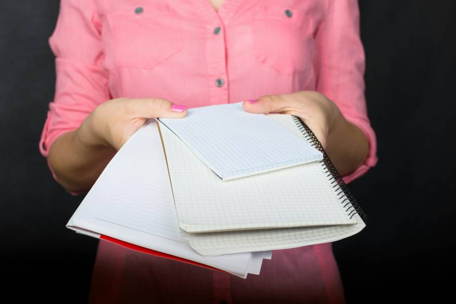 Folder of medical paperwork prepared for a research screening conversation.